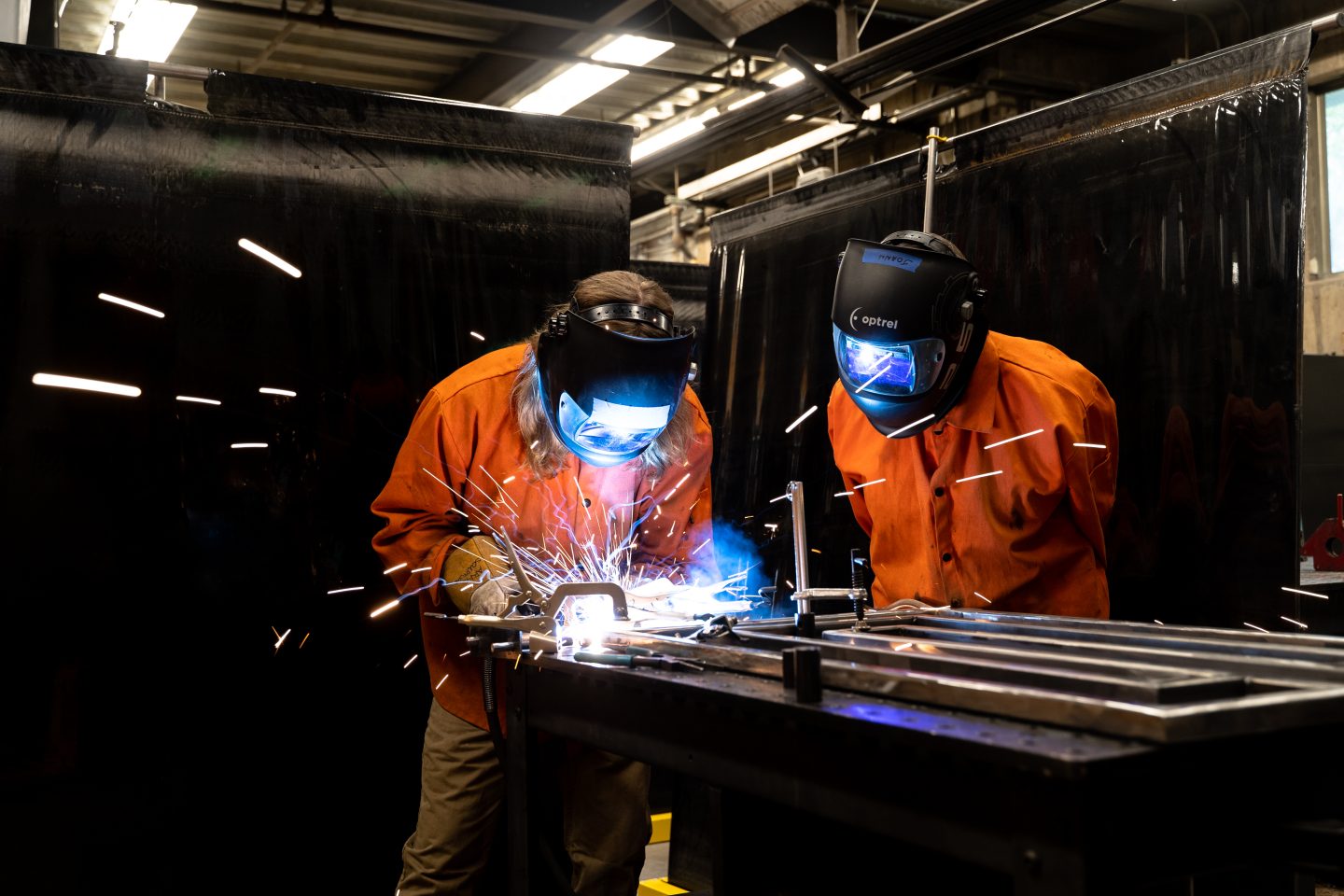 two artists welding metal sculpture together in a studio workshop at Anderson Ranch Arts Center