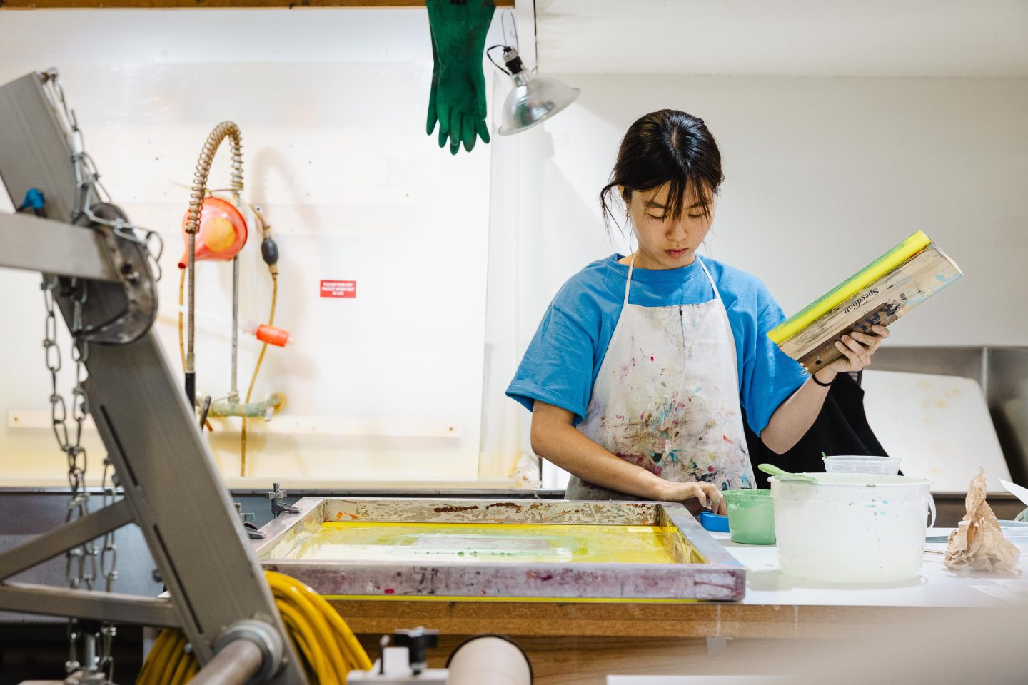 artist creating a print in a printmaking studio at Anderson Ranch Arts Center