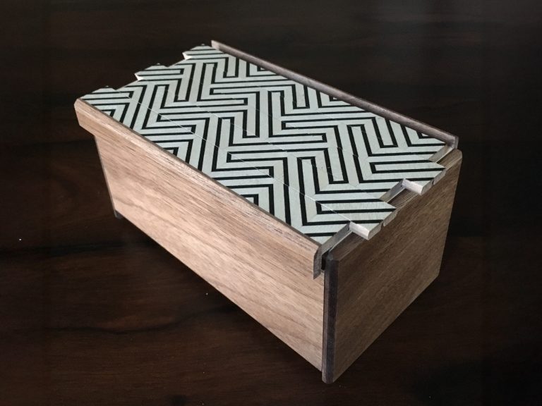 traditional Japanese puzzle boxes displayed on a woodworking studio table at Anderson Ranch Arts Center